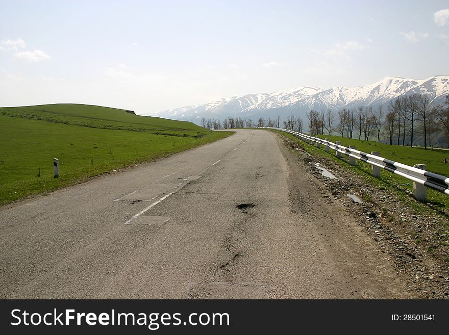 Mountain Road in Armenia with Snow capped peaks