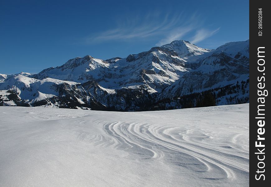 Snow covered mountains in the Swiss Alps. Snow covered mountains in the Swiss Alps.