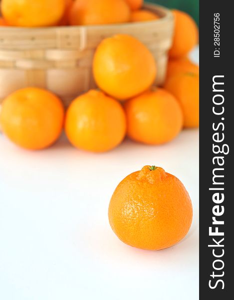 Small basket of clementine oranges. Small basket of clementine oranges.