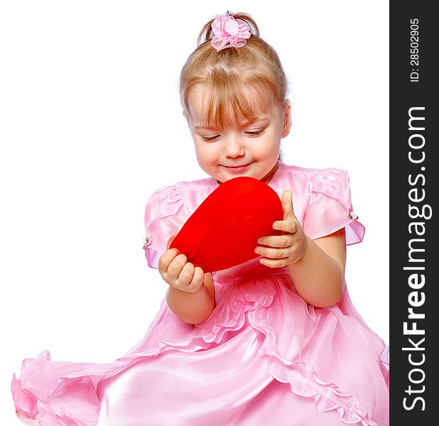 Beautiful girl in a wreath holding a heart on a white background