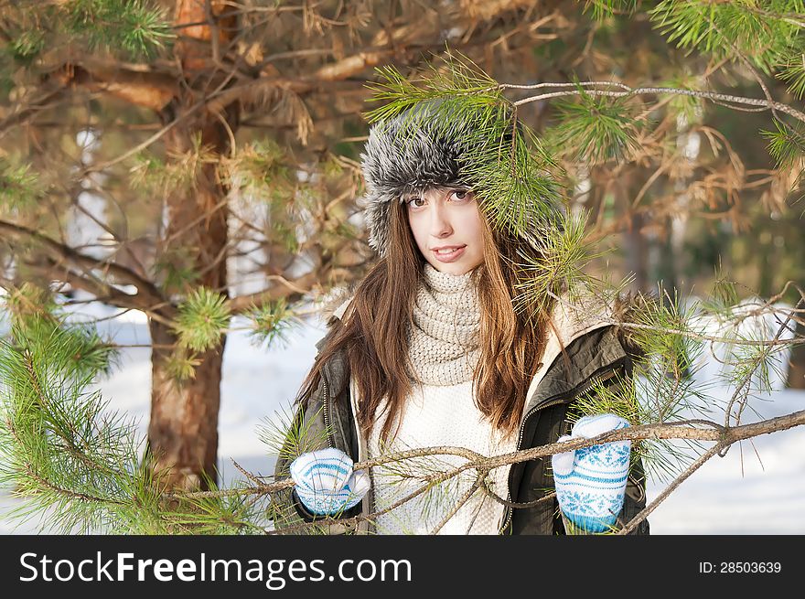 Smiling girl walk in the winter forest. Smiling girl walk in the winter forest