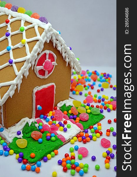 Little decorated gingerbread house and colorful candy. Little decorated gingerbread house and colorful candy