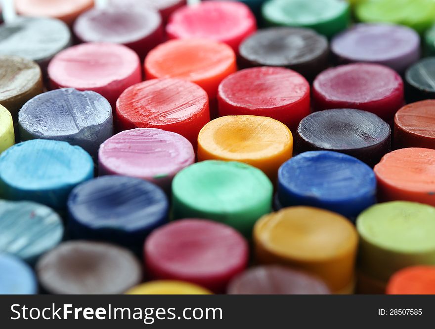 Back of colorful crayon pencils set together arranged to display their vivid and bright colors. Back of colorful crayon pencils set together arranged to display their vivid and bright colors