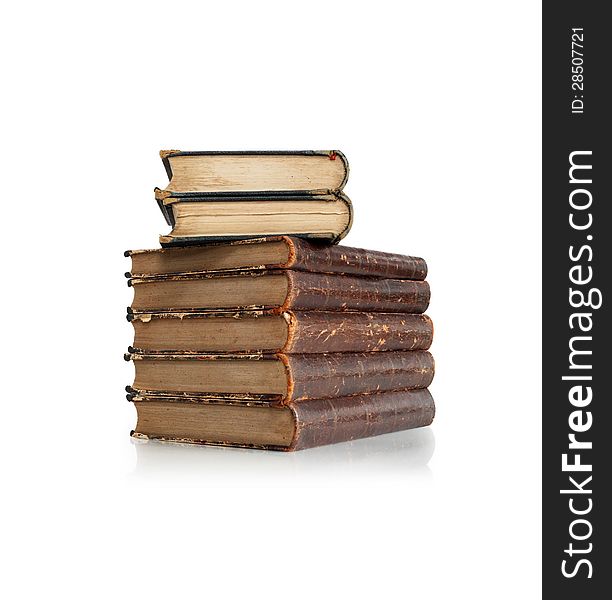 Stack of old books on white background. Clipping path is included. Stack of old books on white background. Clipping path is included
