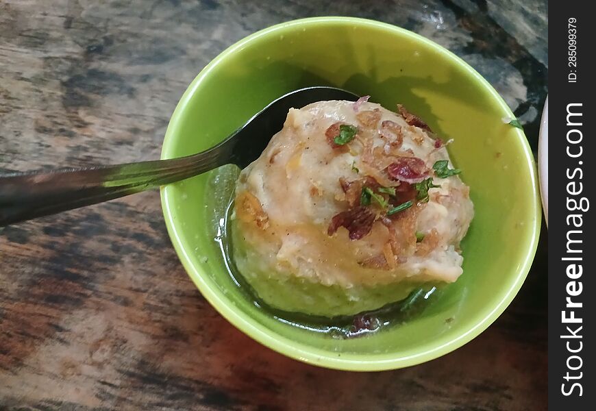 Meatball served in a green bowl