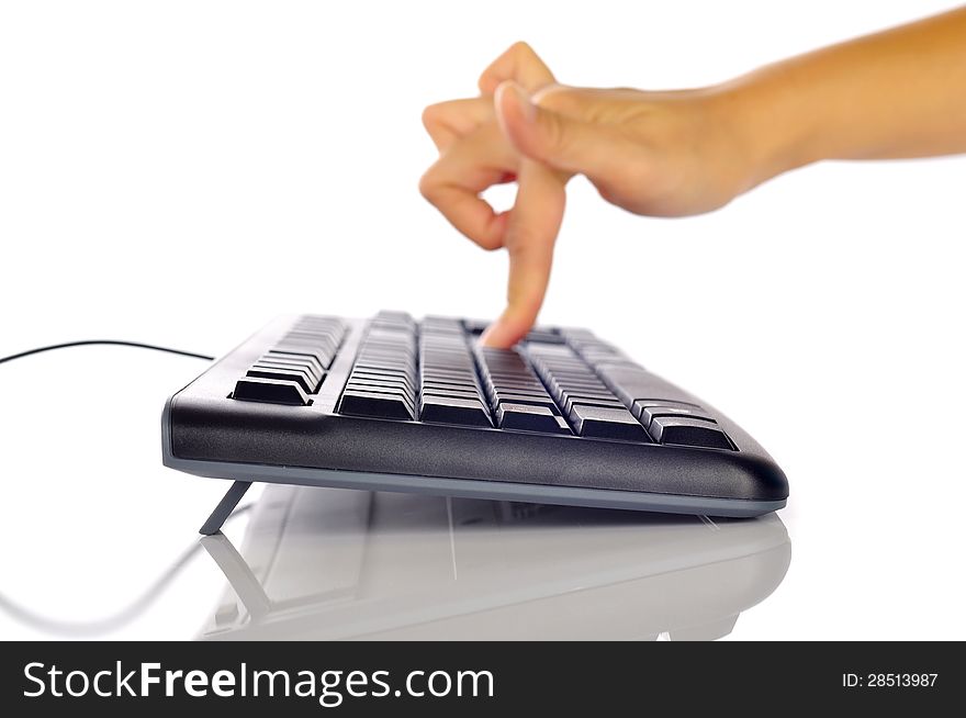 Woman hand typing on black computer keyboard over white background. Woman hand typing on black computer keyboard over white background