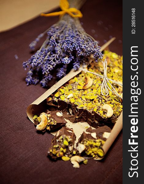 Homemade chocolate with lavender, brown background