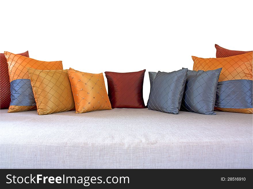 The colorful pillows scattered on the table.