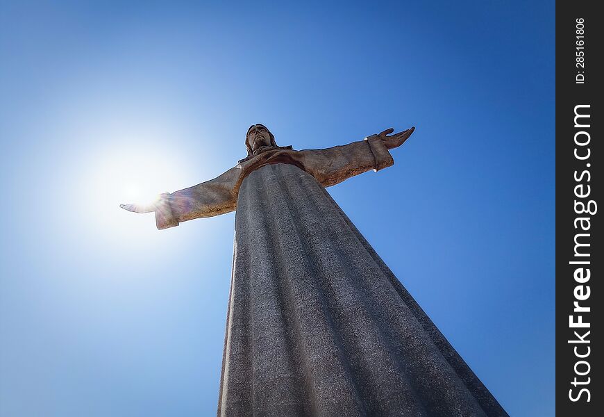 The Sun in the hand of Jesus, statue Lissbon, Portugal