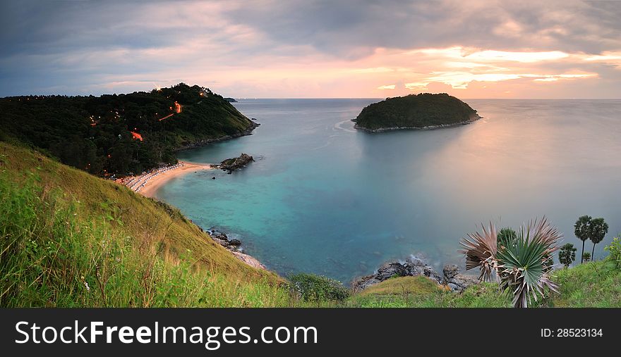 Cape is a mountain of rock that extends into the sea in Phuket, Thailand. Cape is a mountain of rock that extends into the sea in Phuket, Thailand