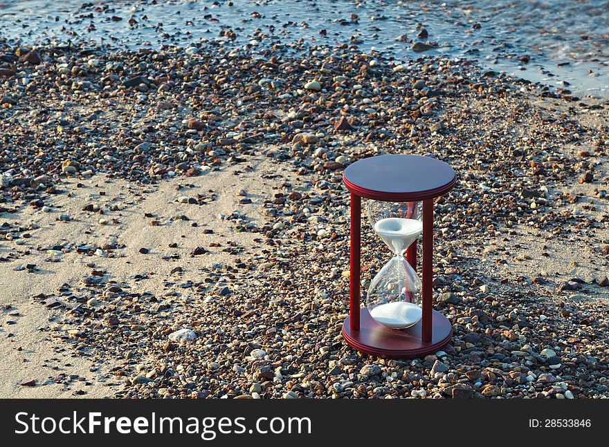 Hourglass on the beach