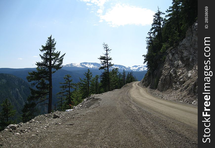 A narrow road to the mountains going to the coastal area. A narrow road to the mountains going to the coastal area.