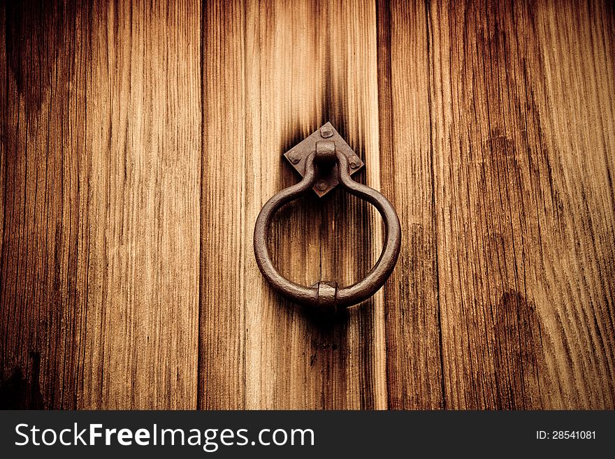 Old fashioned wooden door and knocker. Old fashioned wooden door and knocker