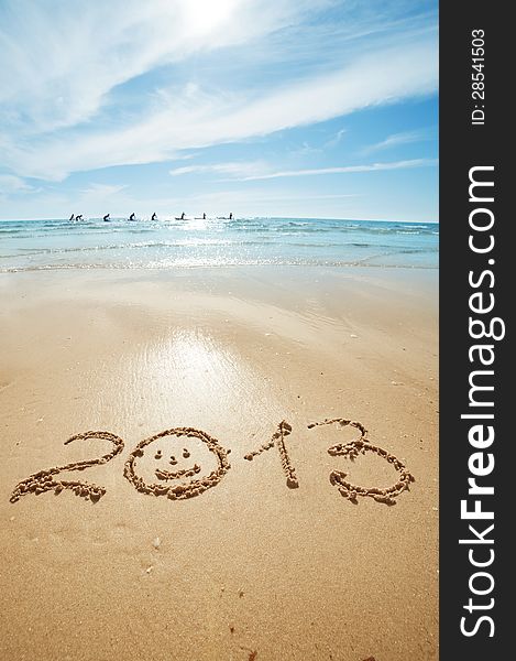 Digits 2013 on the sand seashore - concept of new year. Digits 2013 on the sand seashore - concept of new year