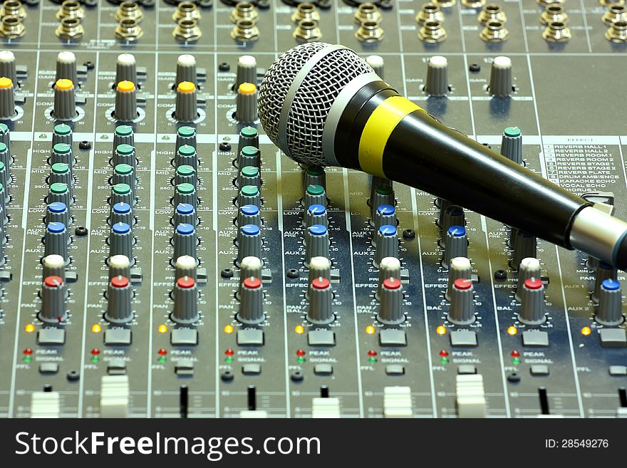 Microphone on a sound mixer or mixing desk sound studio. Microphone on a sound mixer or mixing desk sound studio