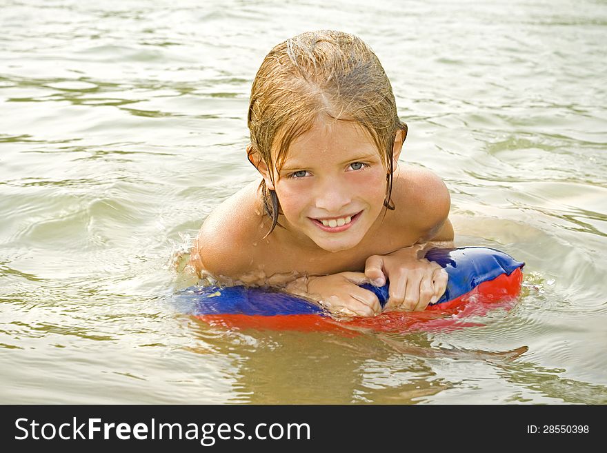 Child learns to swim-happy child