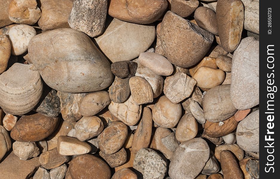 Pebbles laid out on a beach. Pebbles laid out on a beach