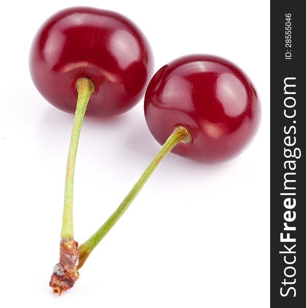 Two cherries on a white background.