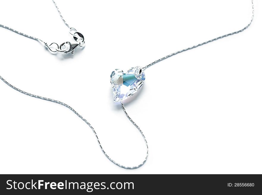 Romantic neclace with a crystal heart. Love symbol. Useful as valentines greeting card or wedding invitation. Romantic neclace with a crystal heart. Love symbol. Useful as valentines greeting card or wedding invitation.