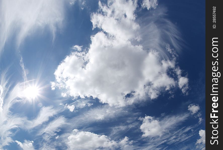 Blue sky with clouds and sun. Blue sky with clouds and sun.