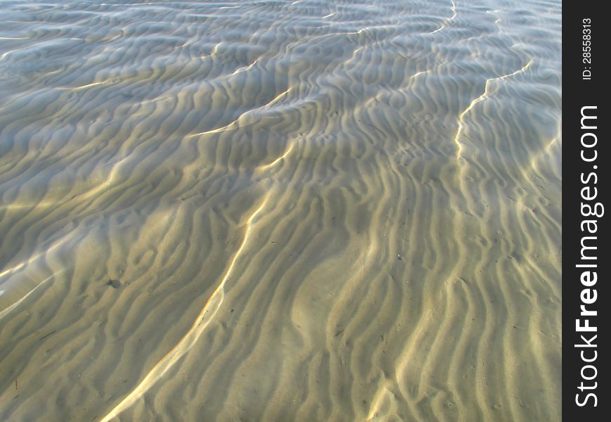 Sand field under the clear water surface. Sand field under the clear water surface.