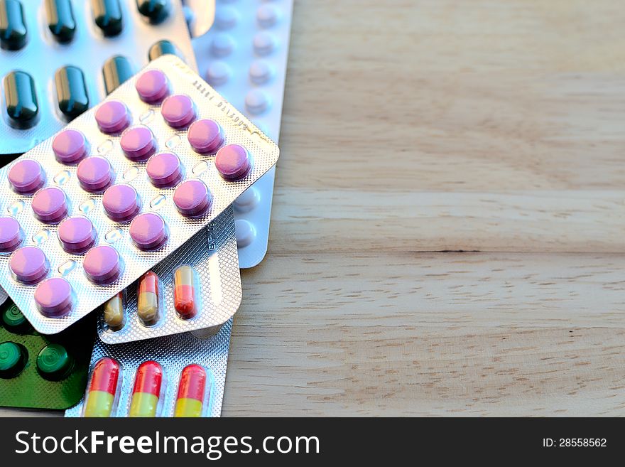 capsules and tablets on a table.