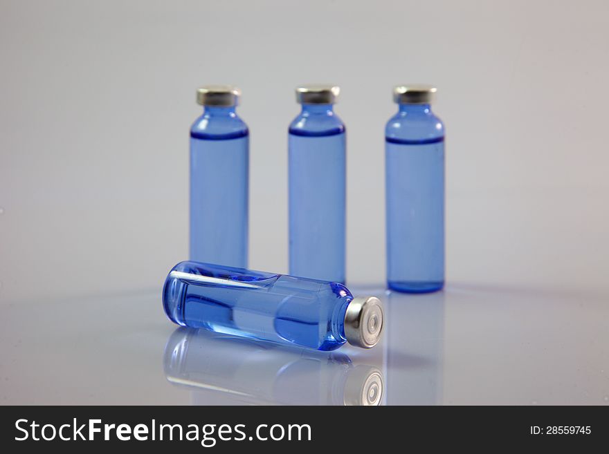 Bottle of medicine on gray background