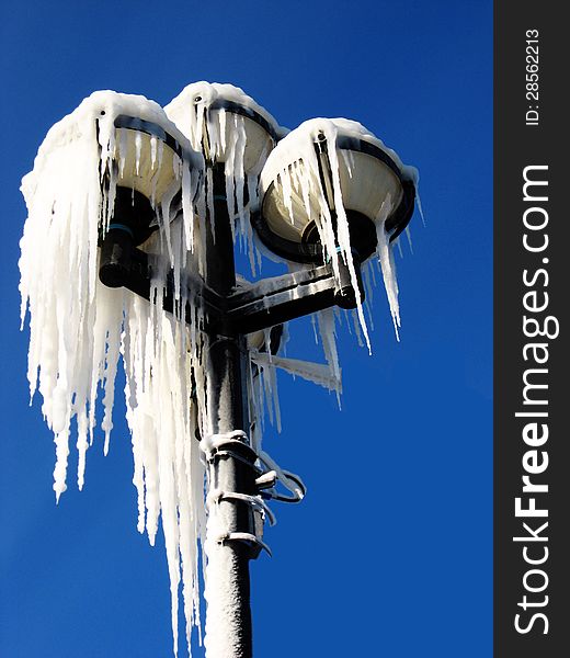 Street light coved in icicles. Street light coved in icicles.