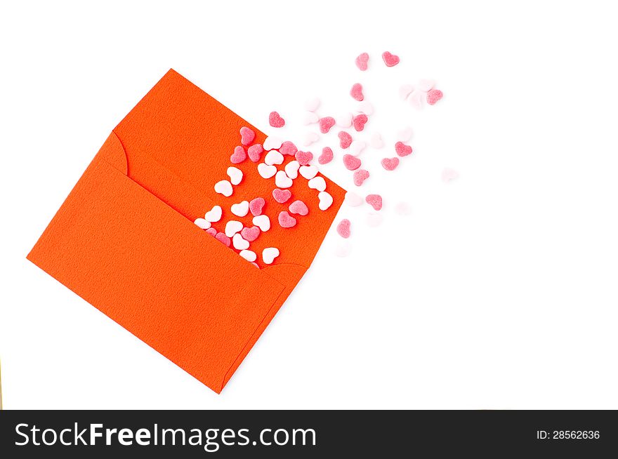 Red envelop and many small sugar hearts. Red envelop and many small sugar hearts