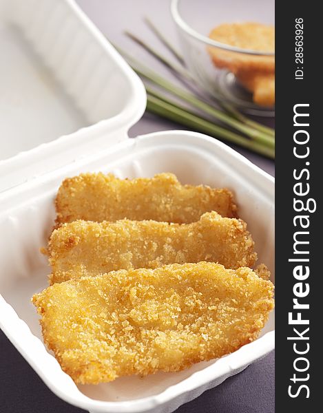 Close up with fish fillet in white box