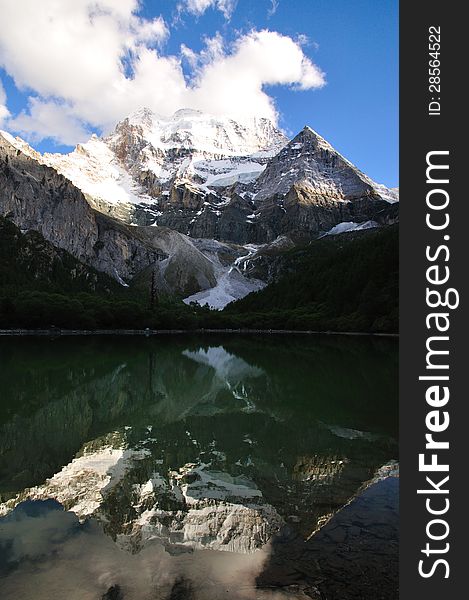 Lake reflection with snow-capped mountains. Lake reflection with snow-capped mountains