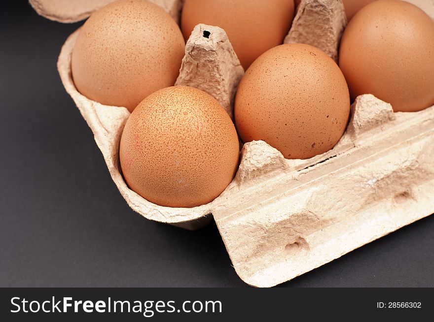 Eggs in an Egg Carton on a black background