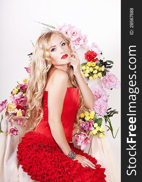 Beautiful Fashion Girl with red makeup and Roses.