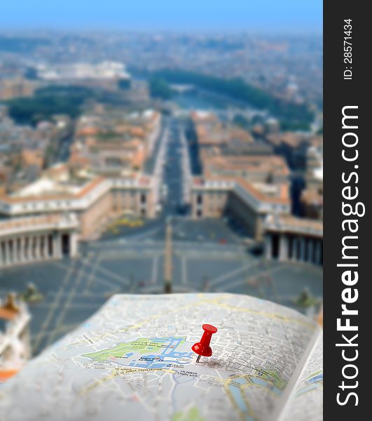 Push pin pointing St. Peter´s square on Vatican city map. Push pin pointing St. Peter´s square on Vatican city map