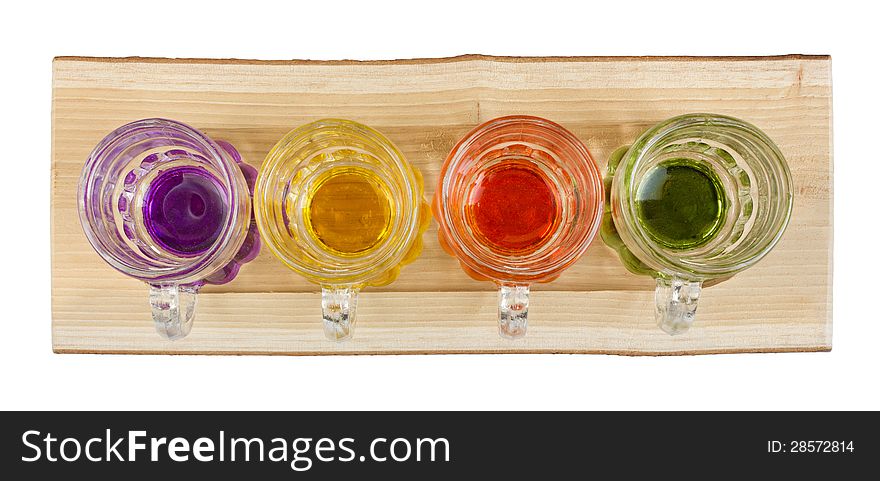 Four Mini Pitchers On A Wooden Tray