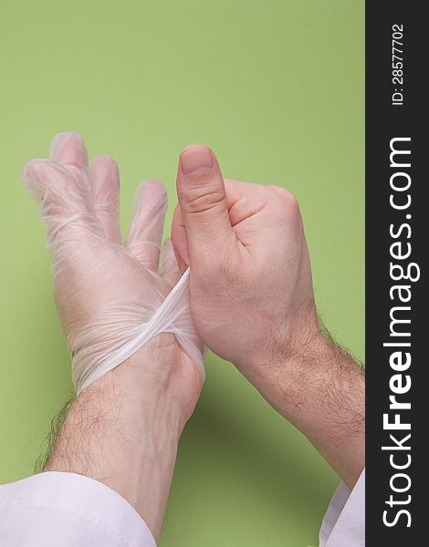 Doctor Taking Off Latex Surgical Gloves