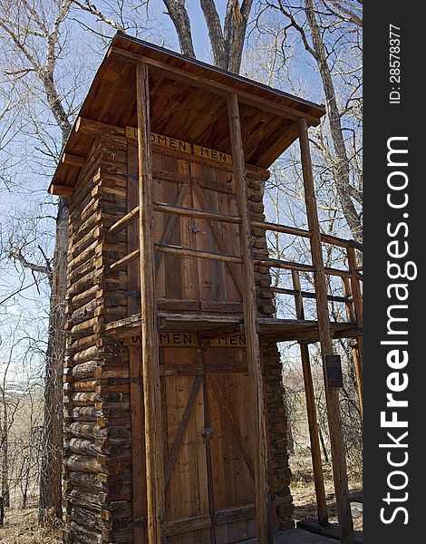 The double decker or two story outhouse bathroom for women and men is built from logs. The double decker or two story outhouse bathroom for women and men is built from logs.