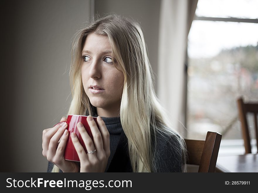 Young Woman Drinking Coffee