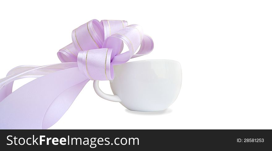 White cup with purple bow on white background