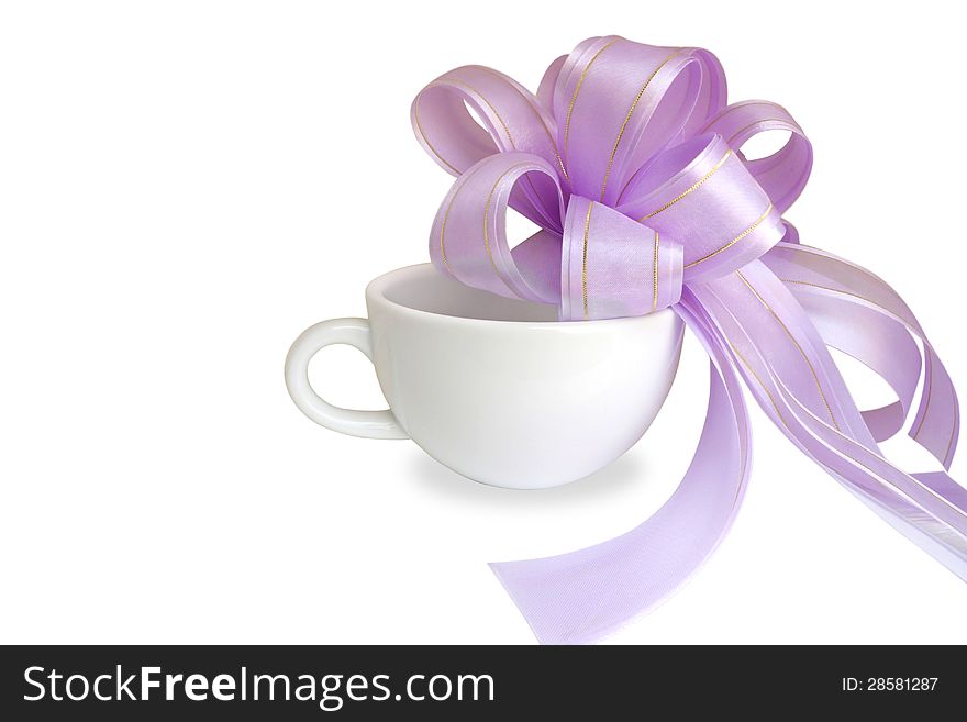 White cup with purple bow on white background