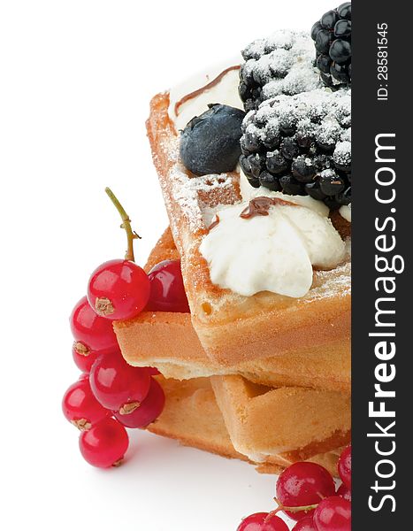 Stack of Delicious Belgian Waffle, Berries and Whipped Cream closeup on white background. Stack of Delicious Belgian Waffle, Berries and Whipped Cream closeup on white background