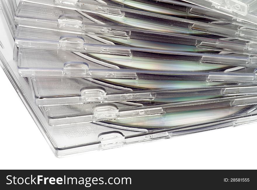 Stack of CD in Transparent Boxes closeup on white background. Stack of CD in Transparent Boxes closeup on white background