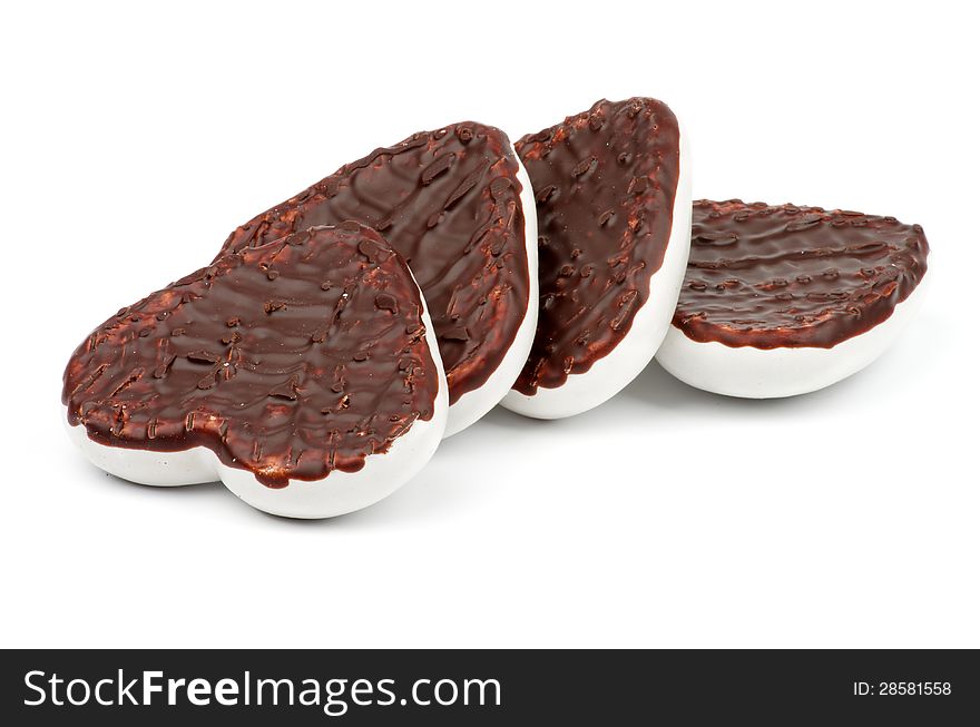 Arrangement of Gingerbread Hearts with Dark and White Chocolate Glaze on white background