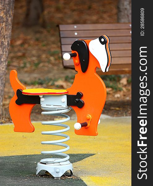 Dog swing spring outdoor on a playground