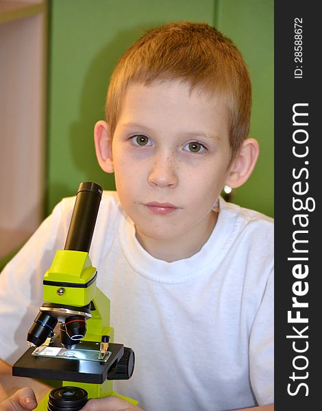 Teenager and microscope