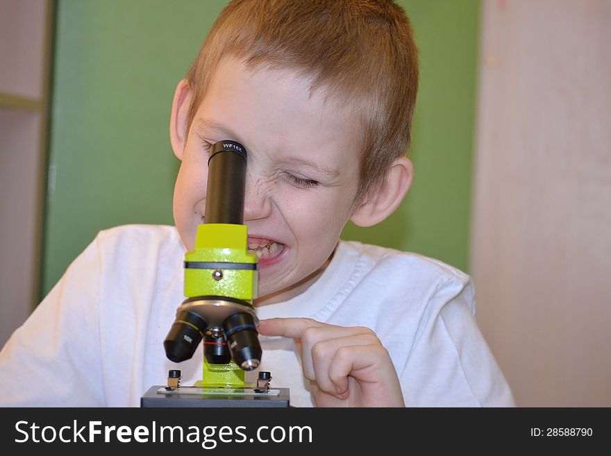 Teenager and microscope