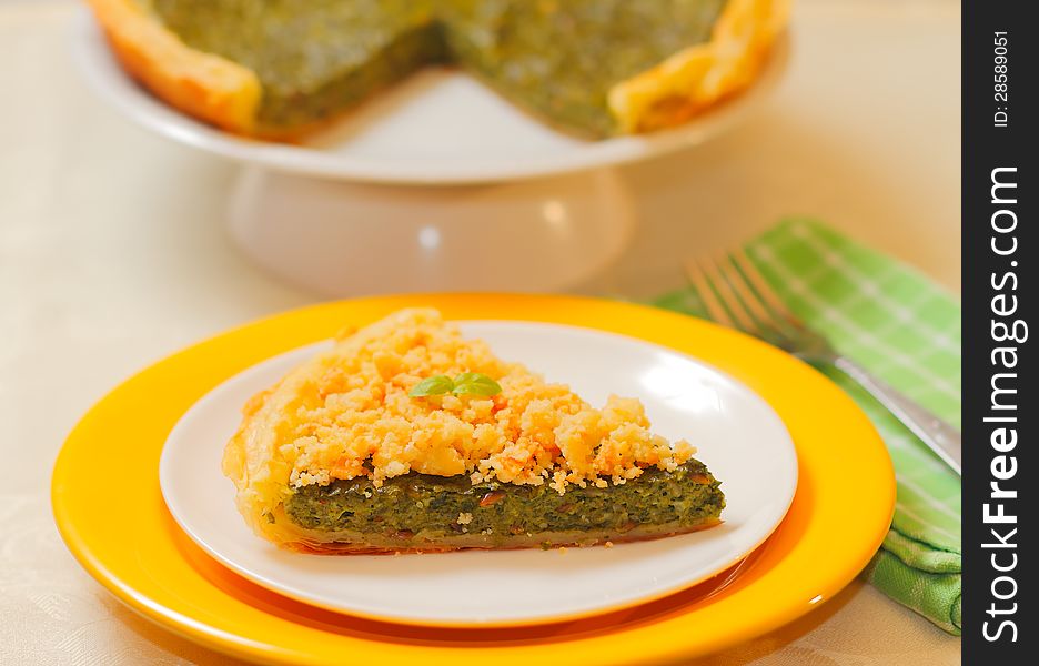 Vegetable spinach and cheese tart with parmesan crumble. Selective focus. Vegetable spinach and cheese tart with parmesan crumble. Selective focus.