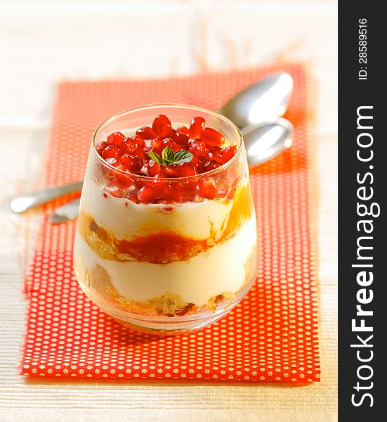 Healthy dessert made from yogurt, sponge cake and pomegranate in small glass. Healthy dessert made from yogurt, sponge cake and pomegranate in small glass