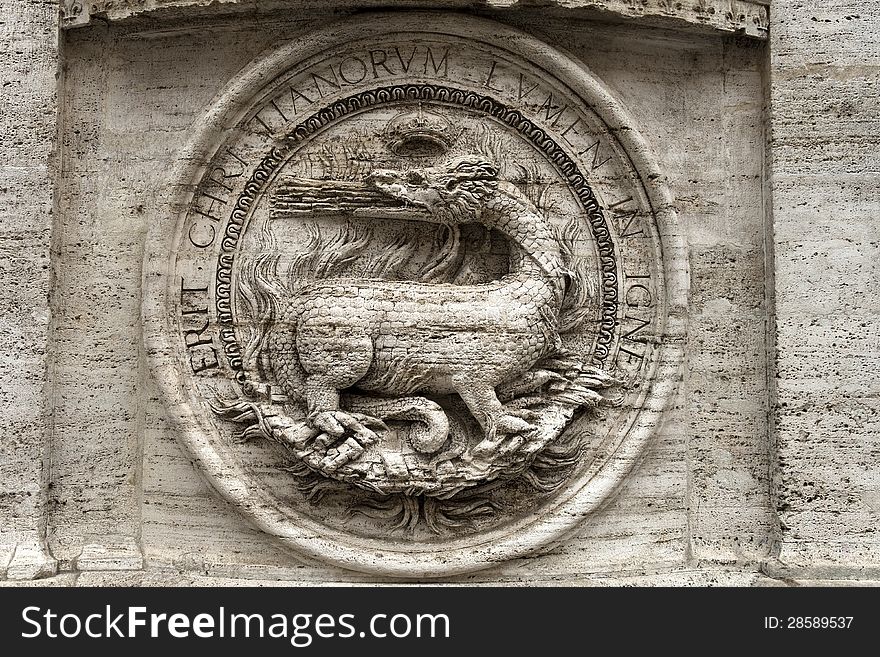 Bas-relief of a fire-breathing dragon on the facade of the Church of St. Louis of the French, titular church in Rome, Piazza Navona