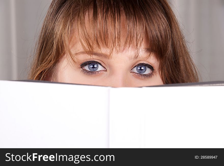 Young teen girl is reading a book. Young teen girl is reading a book.